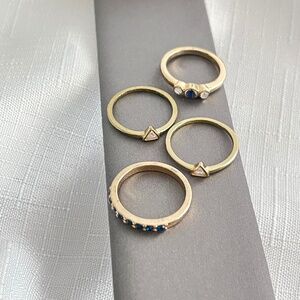 Bundle of 4 Rings Golden Tone  Mix of Stones and Different sizes